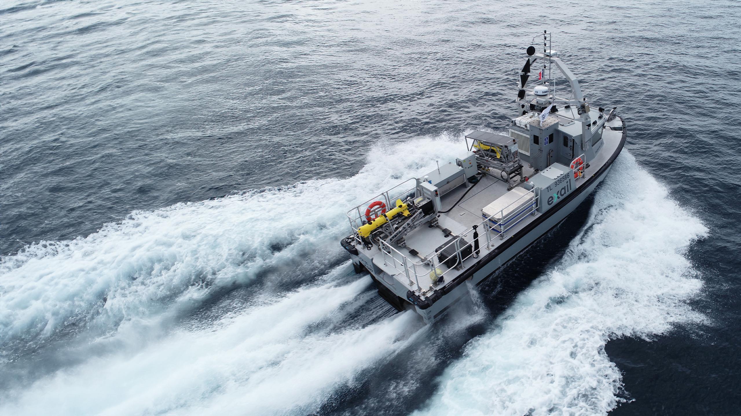 An Exail Inspector 125 surface vessel carrying underwater vehicles at sea